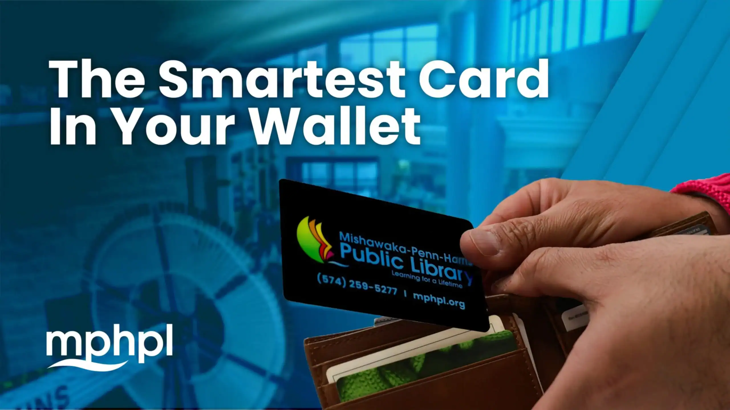 Person holding a Mishawaka-Penn-Harris Public Library card above a wallet. 'The Smartest Card In Your Wallet' against a library backdrop. MPHPL logo.