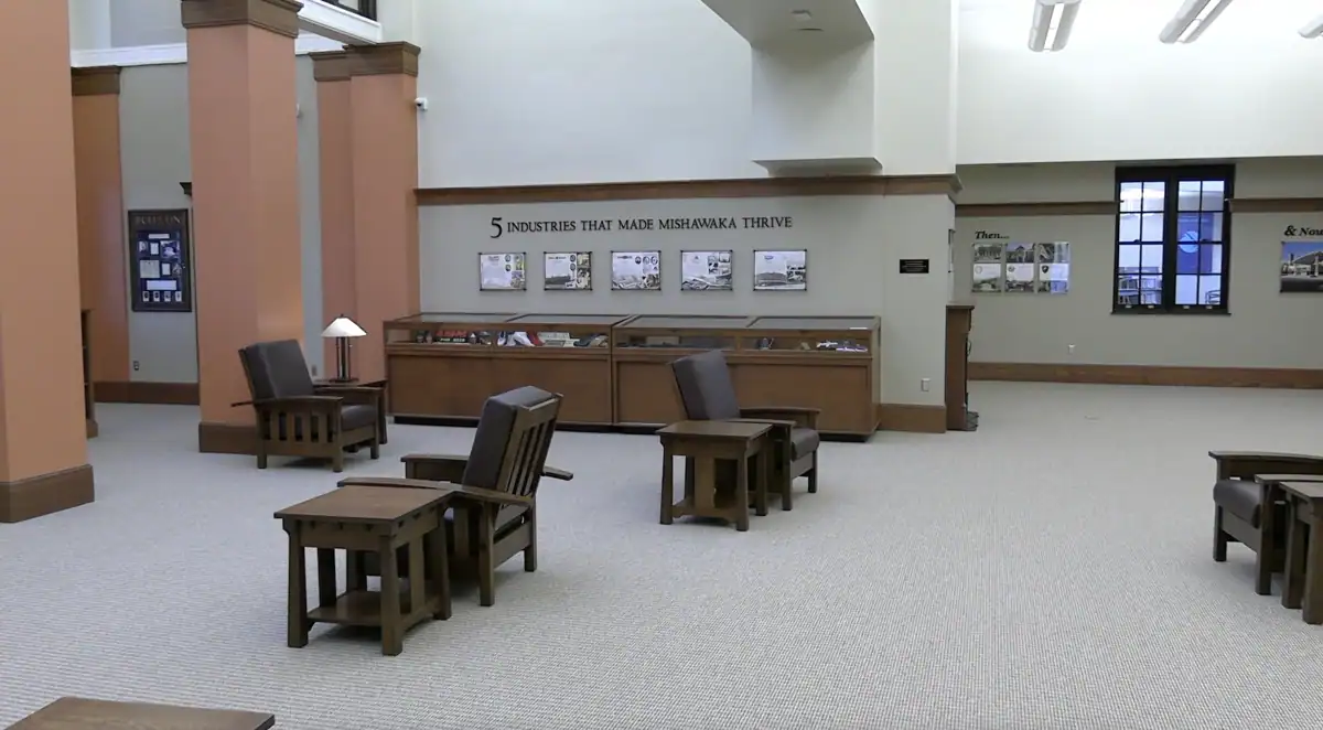 The Mishawaka Library Heritage Room seating and glass displays, containing historical items.